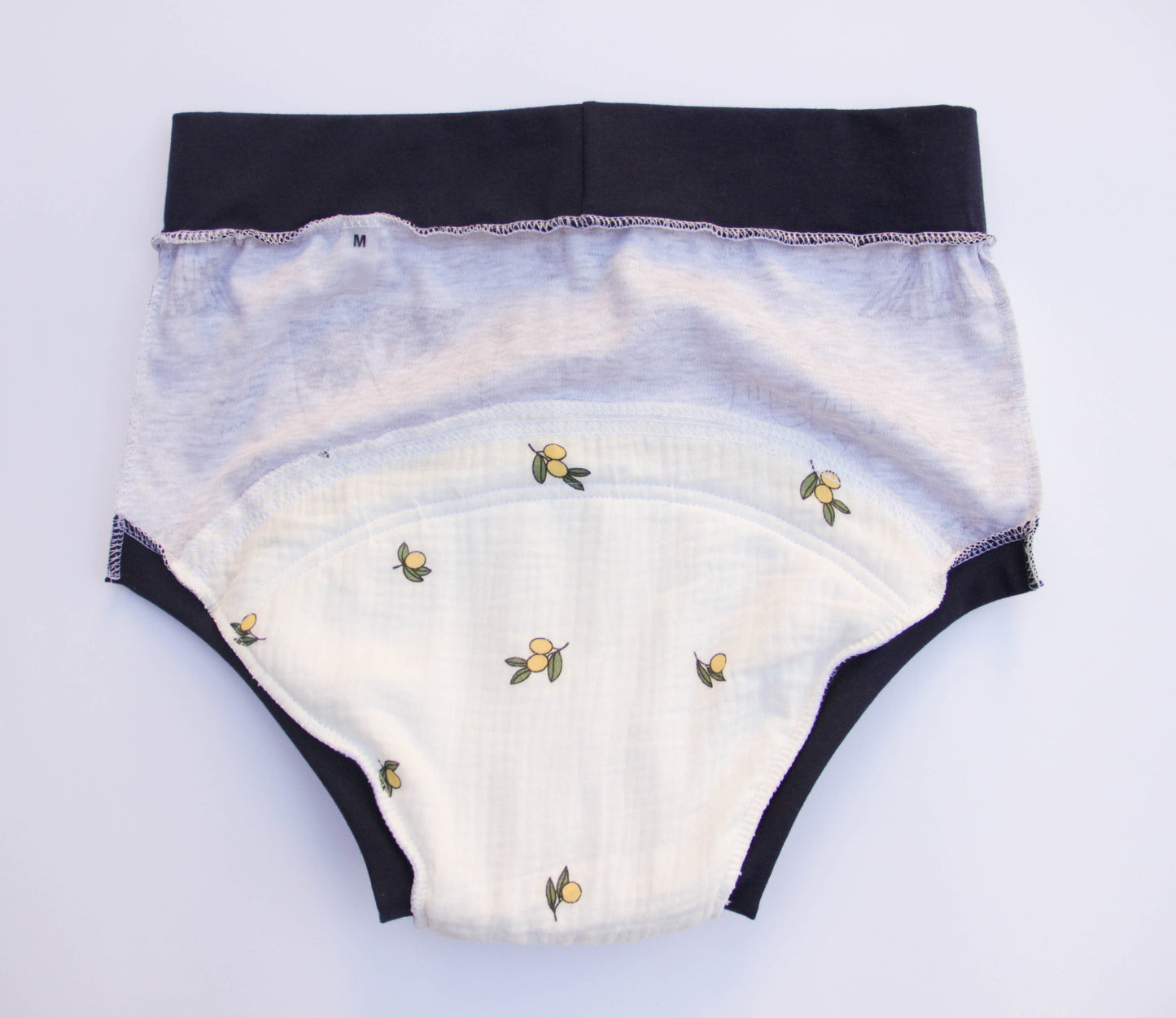 ABDL training pants for adult Dino on a gray background