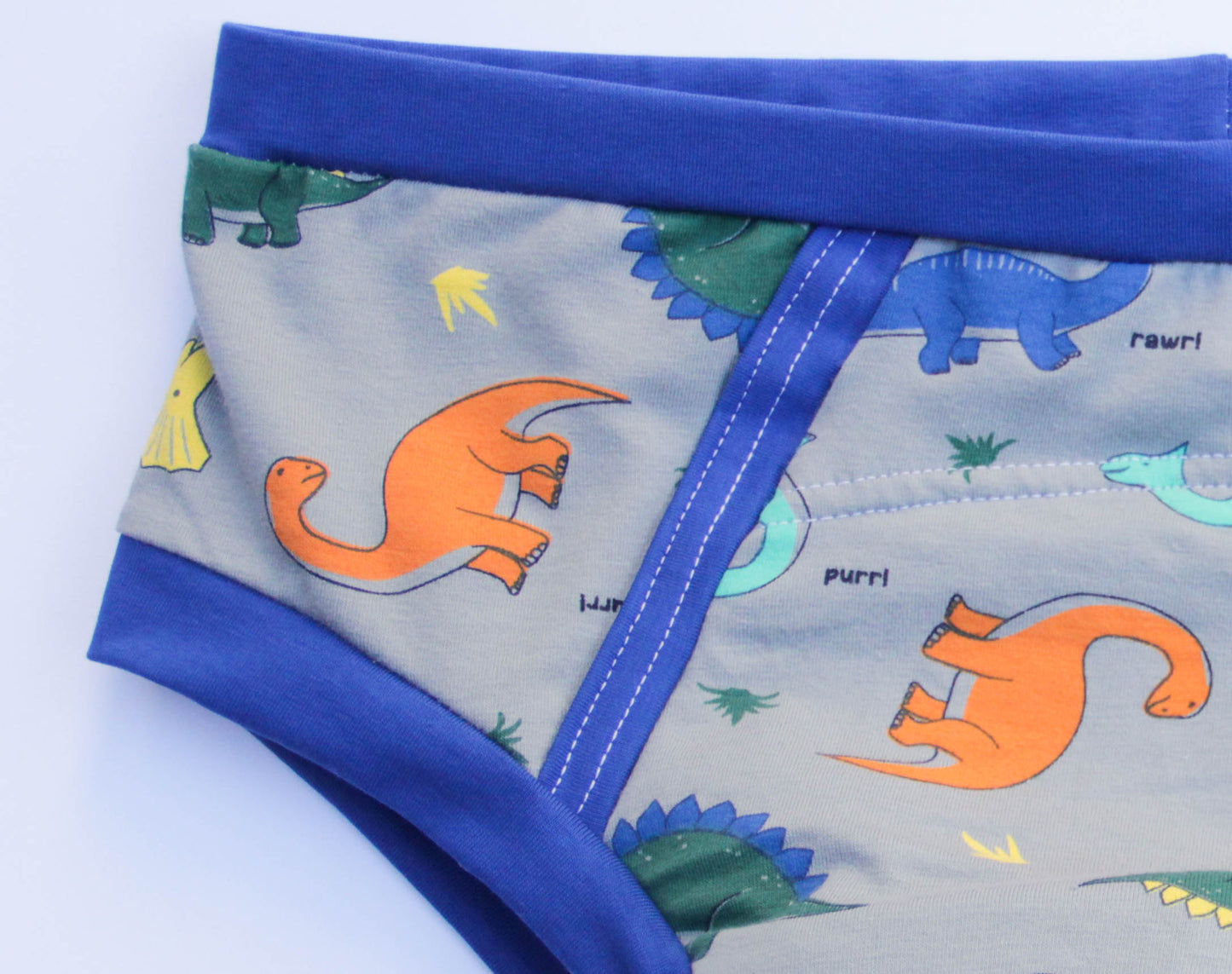 ABDL training pants for adult Dino on a gray background