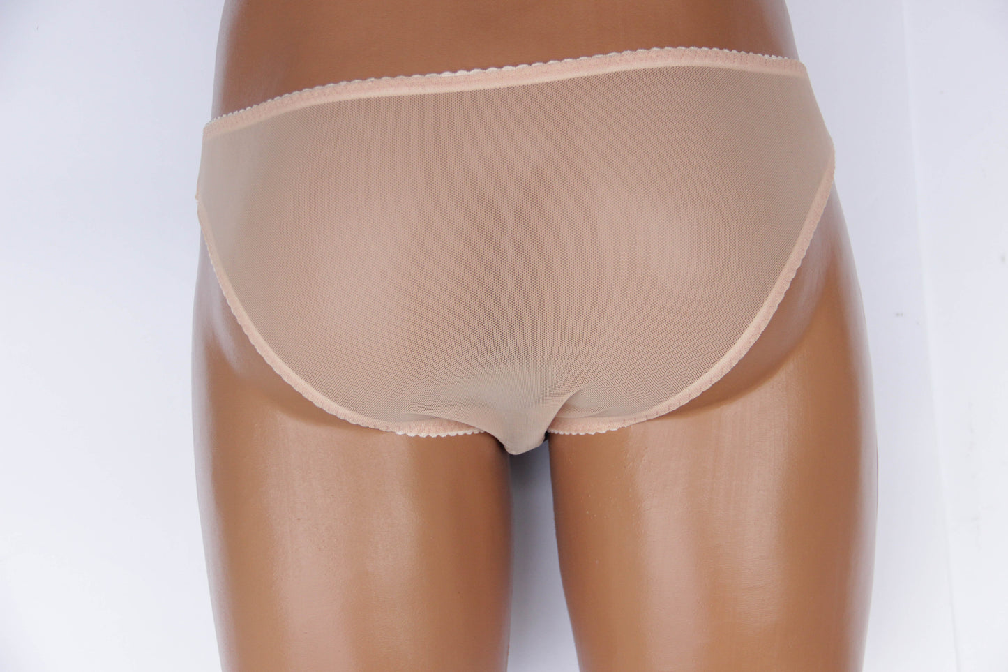 close-up of lace detail on femboy mesh briefs