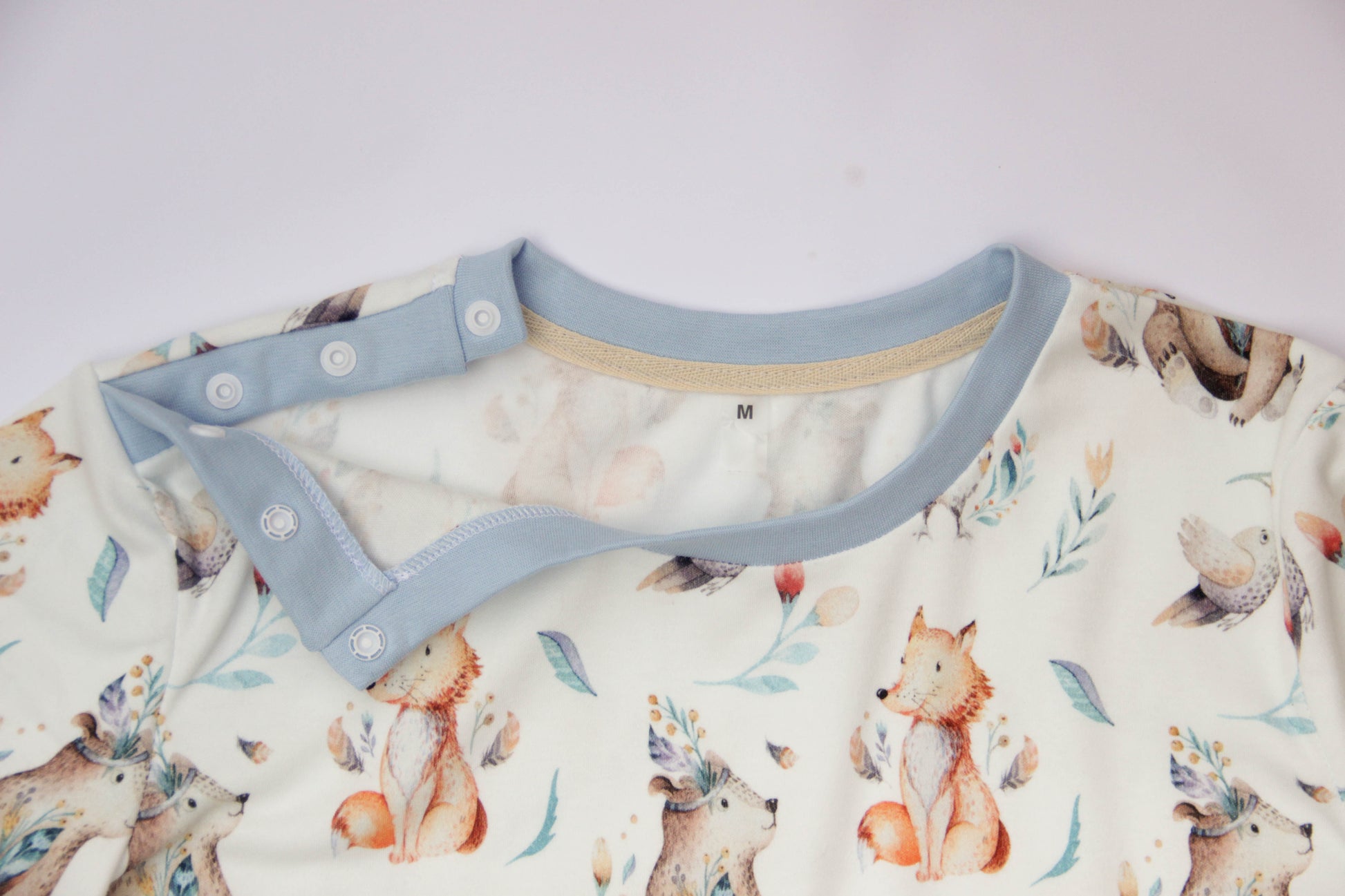 ABDL adult onesie bodysuit with printed design shoulder closure and comfortable fit