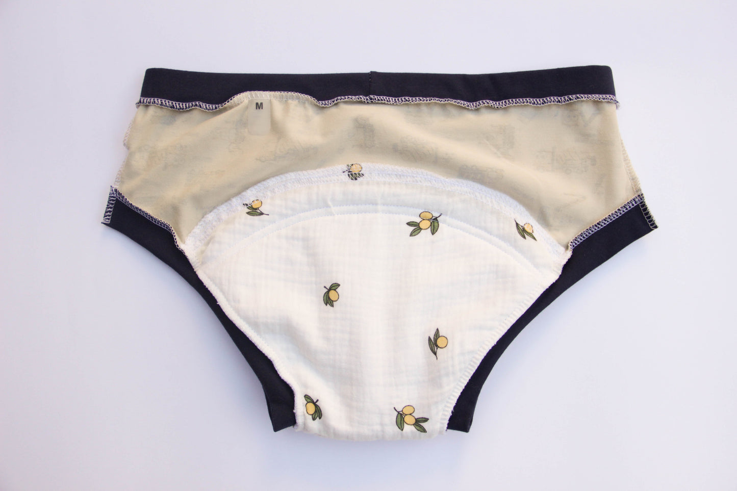 ABDL training pants for adult Tractors on a beige background