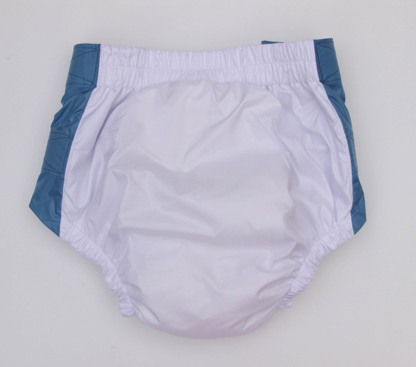 White diaper with blue trim on a light gray background