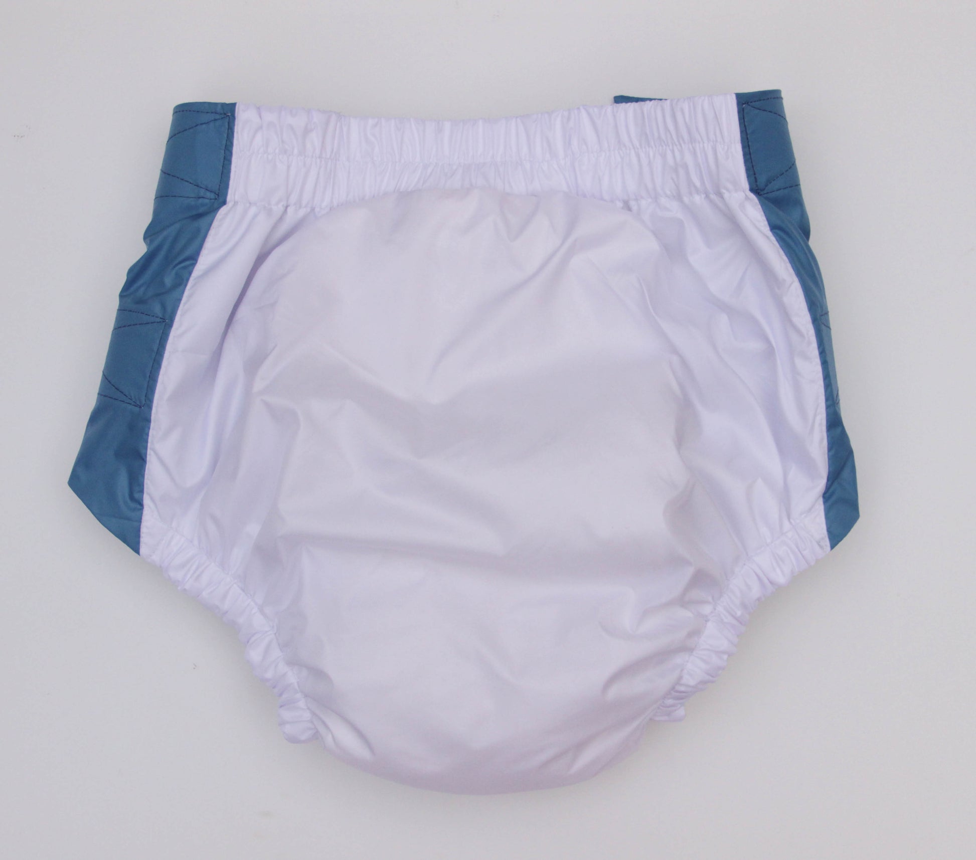 White diaper with blue trim on a light gray background