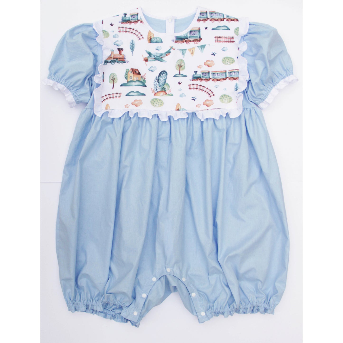 Light blue baby romper with a colorful printed top on a white background
